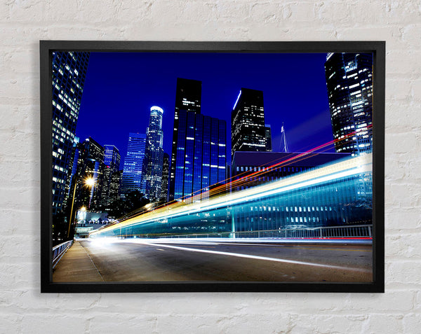Speedway Through The City Framed Print
