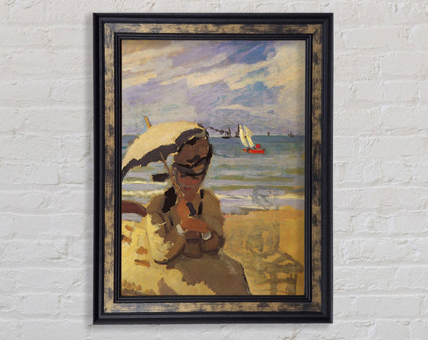 Monet Camille Monet On The Beach At Trouville Framed Print