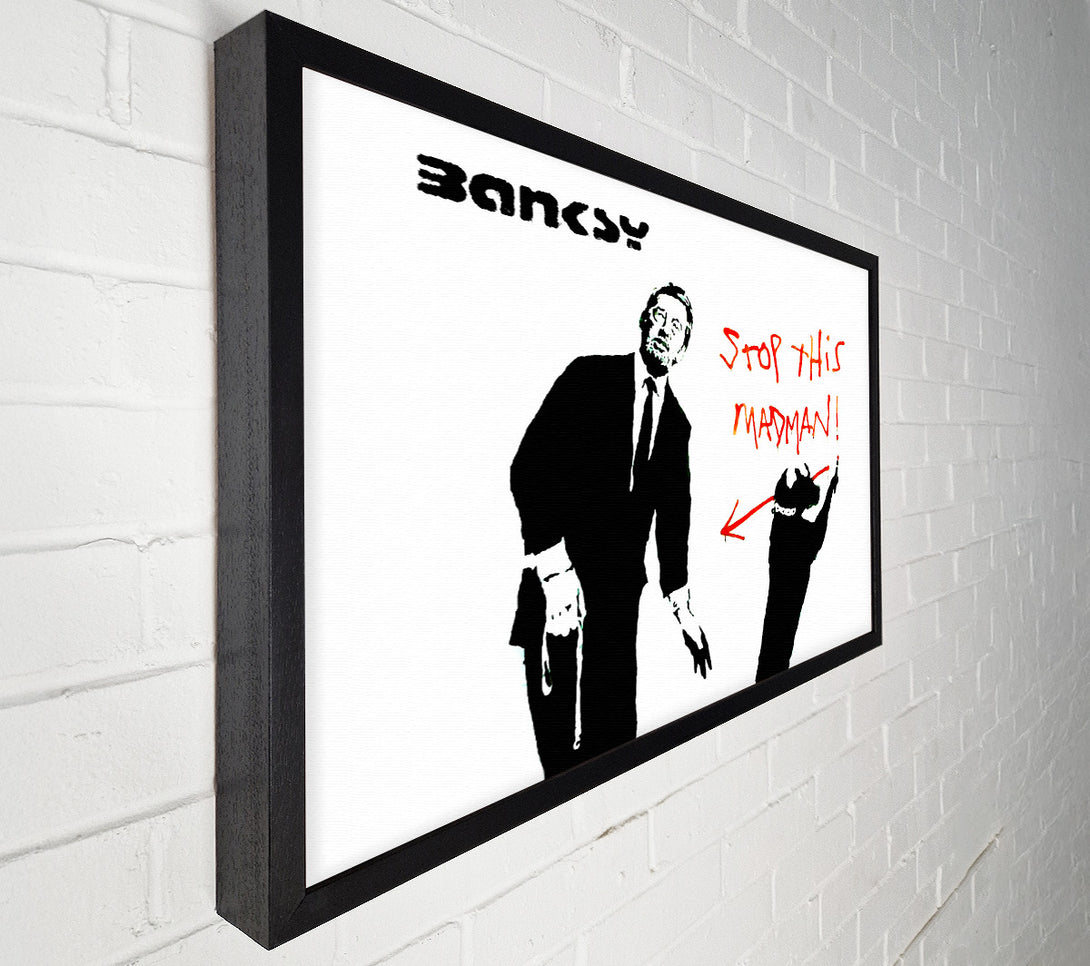  A Canvas Print of Banksy Stop This Madman Canvas Print