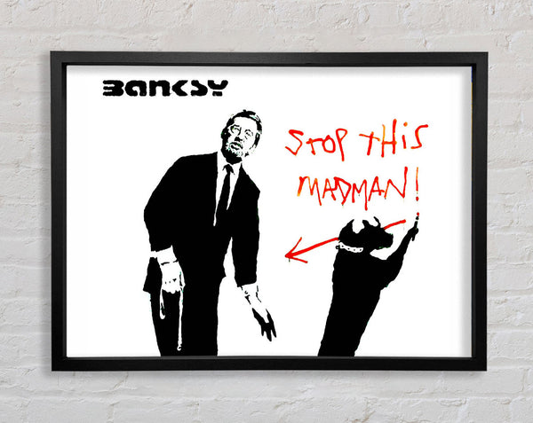 Banksy Stop This Madman Framed Print