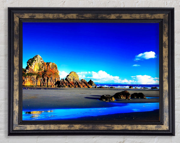 Rocky Blue Beach Framed Print