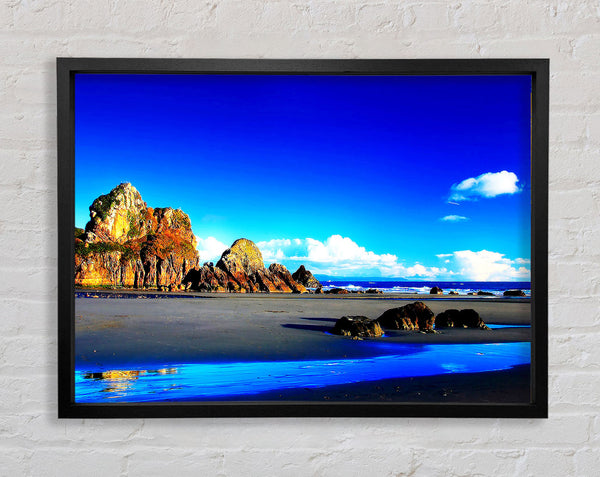 Rocky Blue Beach Framed Print