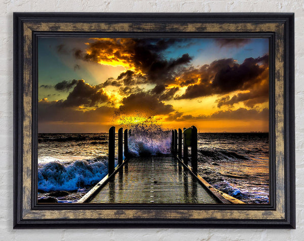 Waves Crashing On The Pier At Sunset Framed Print
