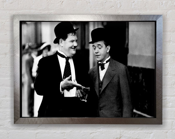 Laurel And Hardy Money Framed Print