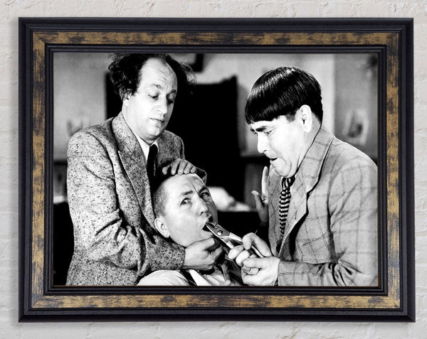 The Three Stooges Tooth Pull Framed Print