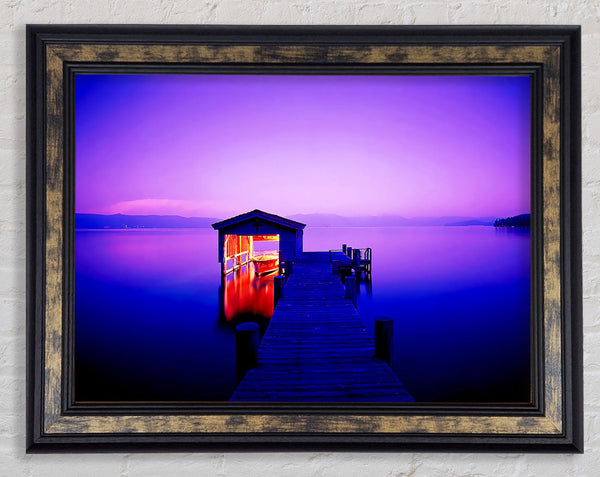 Tranquil Lake Boat House Purple Framed Print
