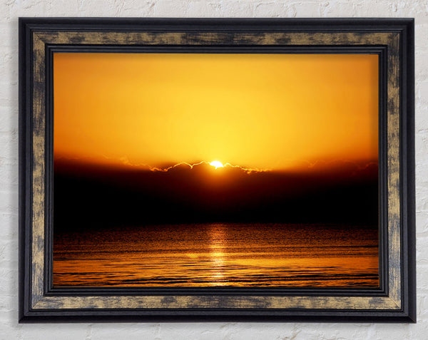 The Last Glimmer Of The Orange Ocean Sun Framed Print