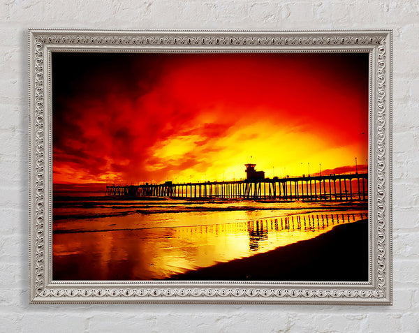 Fire Skies Over The Pier Framed Print