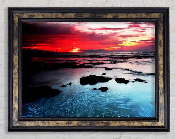 Lava Red Skies Over The Turquoise Ocean Framed Print