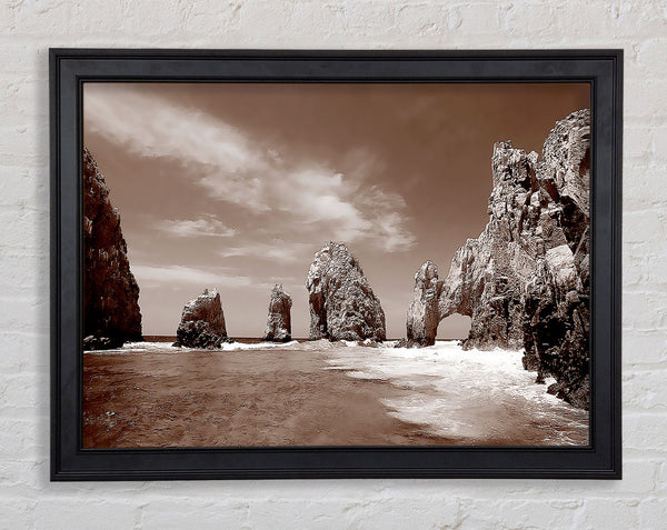 Brown Rocks In The Ocean Framed Print