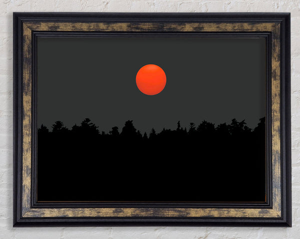 The Red Sun Over The Grey Treeline Framed Print