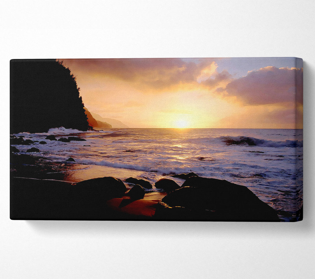  A Canvas Print of As The Sun Goes Down Over The Ocean Canvas Art