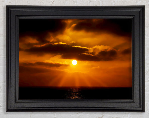 Golden Sun Rays Through The Clouds Framed Print