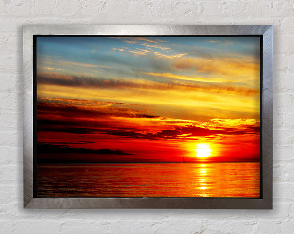 Distant Ocean Sailboat Sunset Framed Print