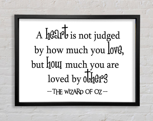 Movie Quote Wizard Of Oz A Heart Is Not Judged Framed Print
