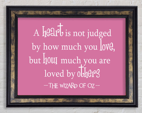 Movie Quote Wizard Of Oz A Heart Is Not Judged Pink Framed Print