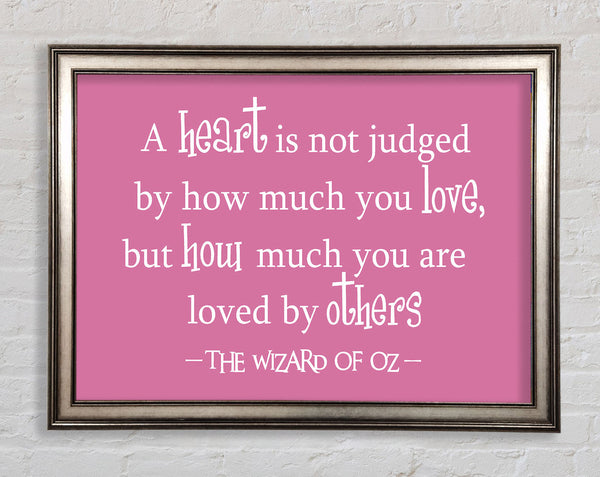 Movie Quote Wizard Of Oz A Heart Is Not Judged Pink Framed Print