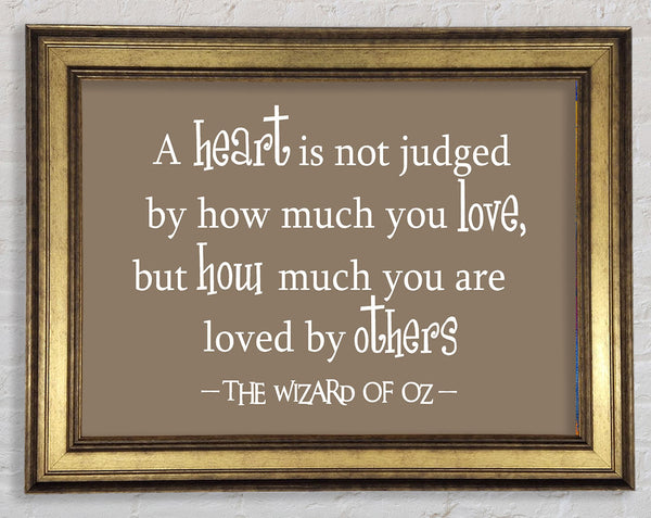 Movie Quote Wizard Of Oz A Heart Is Not Judged Beige Framed Print
