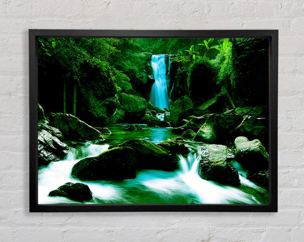 The Waterfall Flows Over The Rocks Framed Print