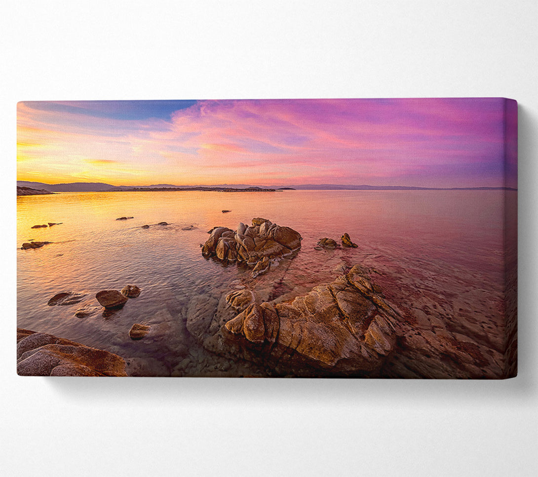  A Canvas Print of Pink Skies Over The Ocean Rocks Canvas Print