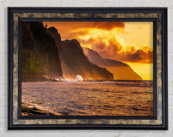 Cliff sunset crashing ocean Framed Print