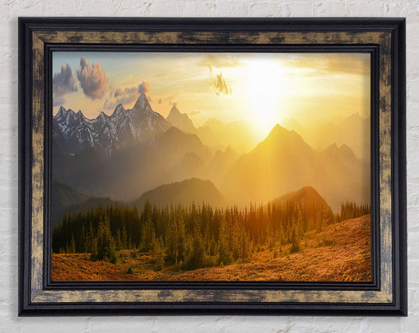 Tall mountains in the sunset Framed Print