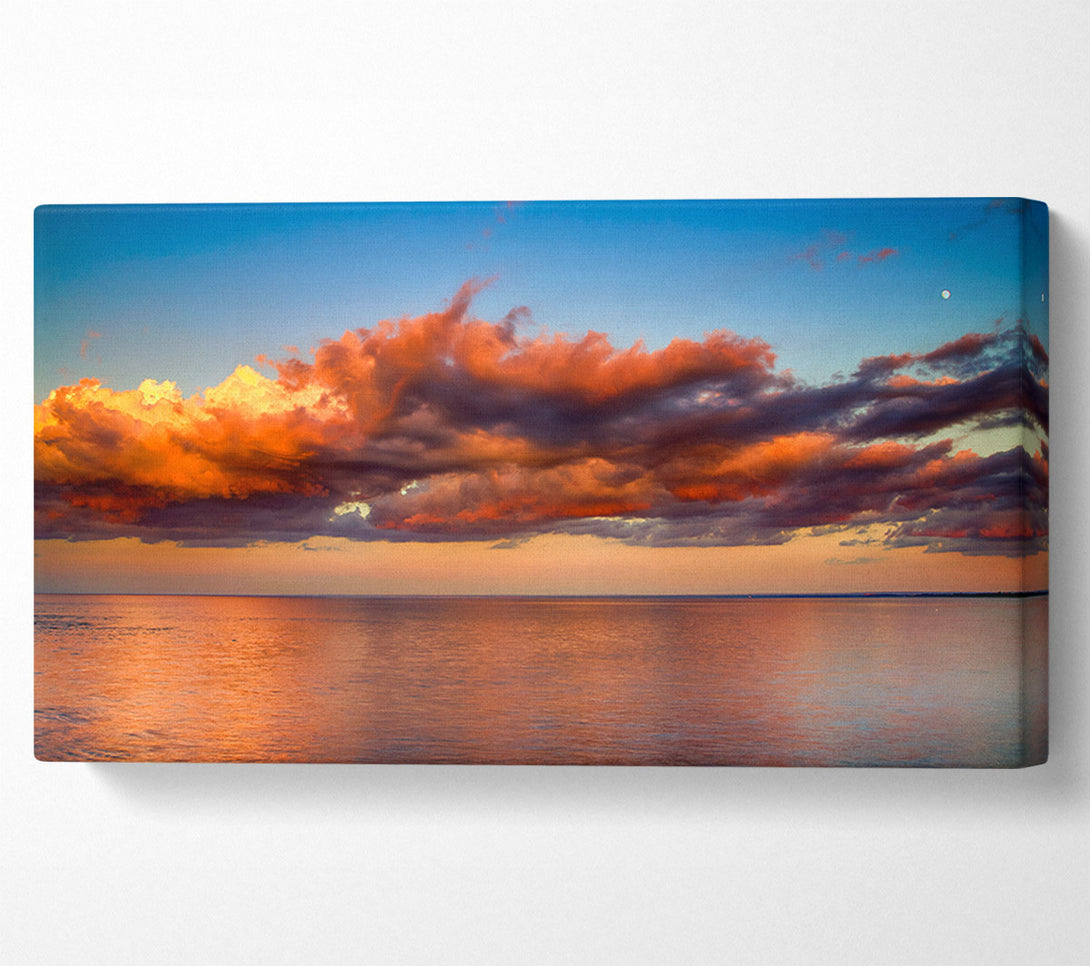  A Canvas Print of Red glowing clouds above the sea Canvas Print