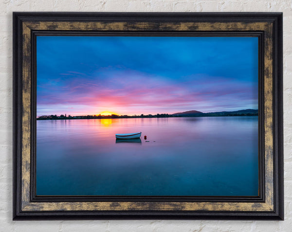 Small row boat on calm lake Framed Print