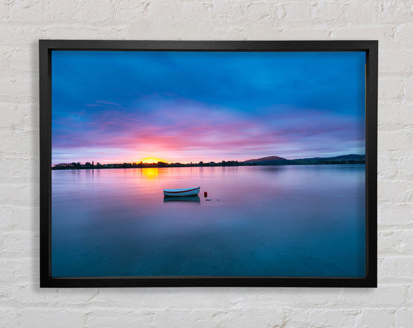 Small row boat on calm lake Framed Print