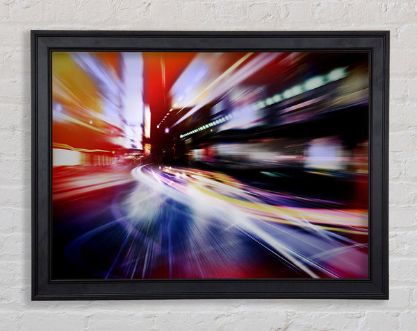 City in a blur colourful light Framed Print