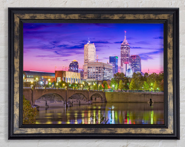 Bridge across the city at night Framed Print