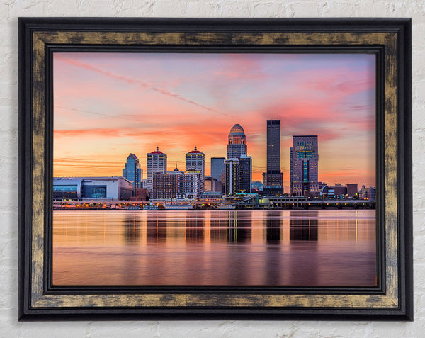 Orange sunset in the city shoreline Framed Print