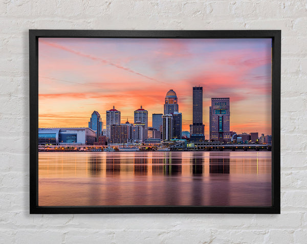 Orange sunset in the city shoreline Framed Print