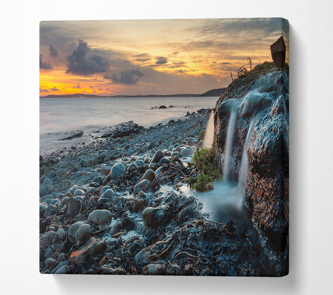  A Canvas Print of Water flows down the rocks into the sea Canvas Wall Art