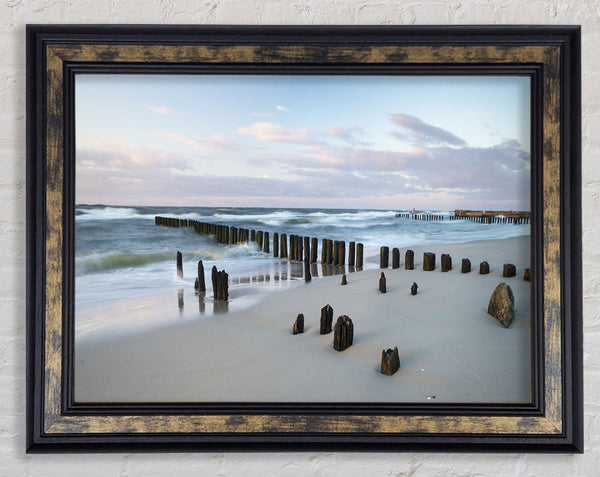 Rough seas on the beach Framed Print