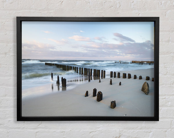 Rough seas on the beach Framed Print