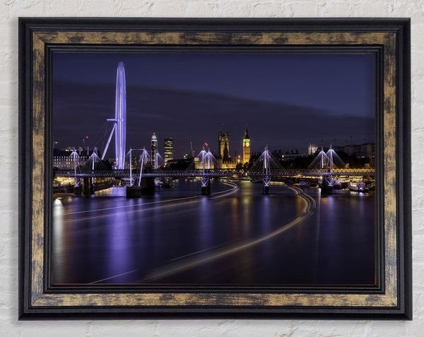 London at night light trails Framed Print