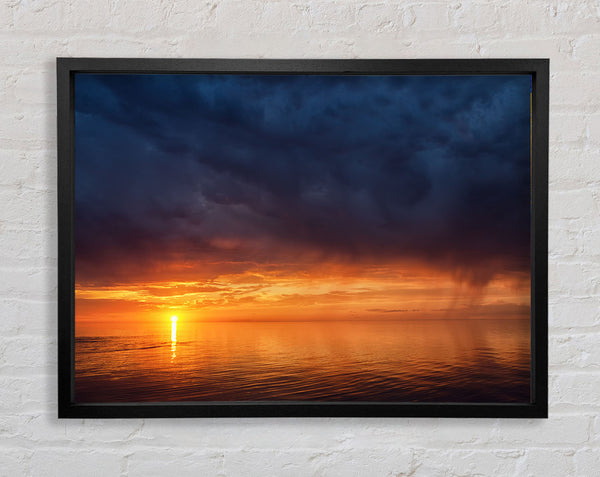 Storms arriving over the sunset Framed Print