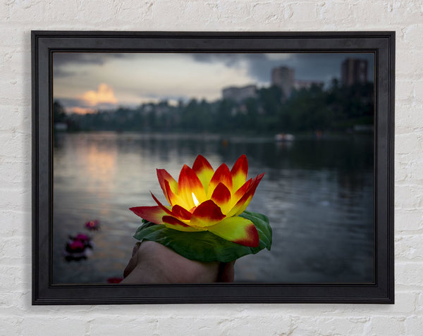 Flower candle in city view Framed Print