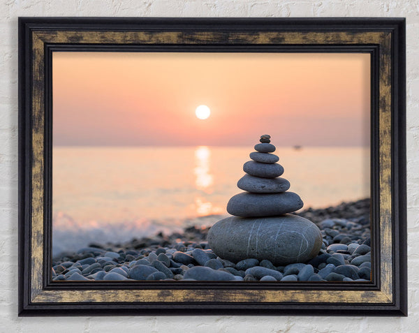 Zen Stones at sunset on the beach Framed Print