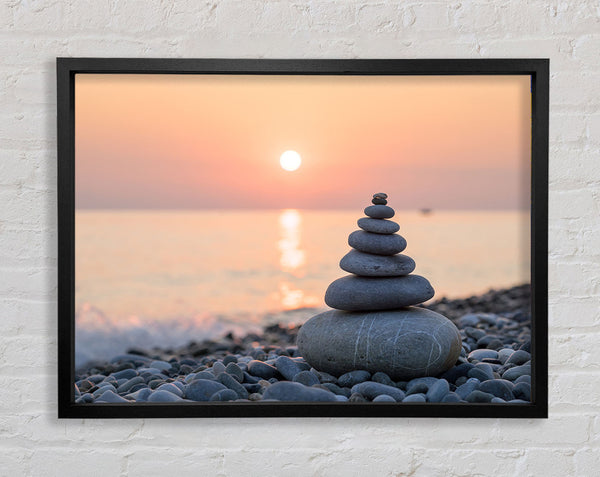 Zen Stones at sunset on the beach Framed Print