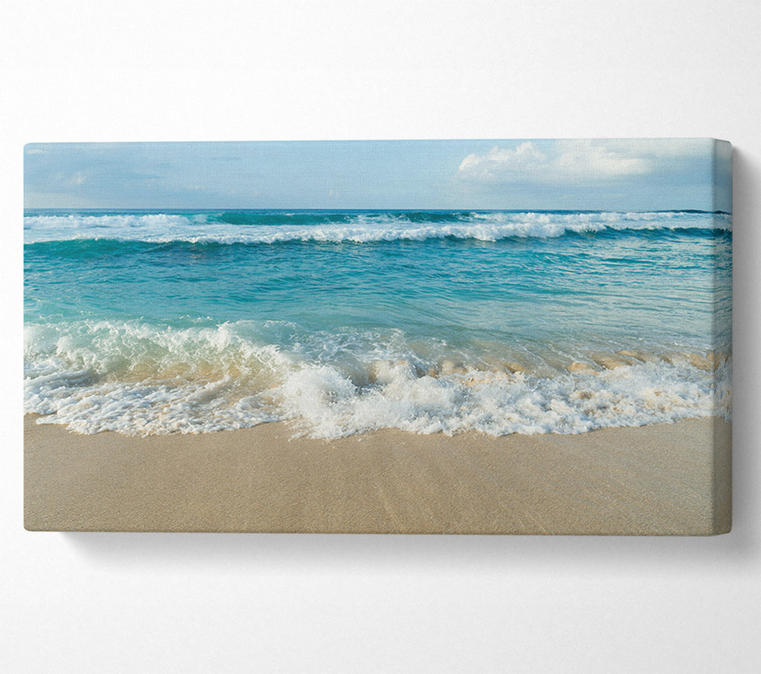  A Canvas Print of Crashing waves on the sandy beach Canvas Art