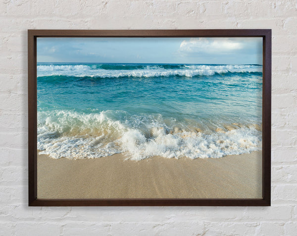 Crashing waves on the sandy beach Framed Print