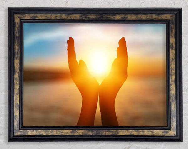 Sunset between hands Framed Print