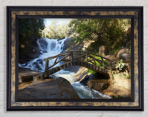 Rustic made bridge by a waterfall Framed Print