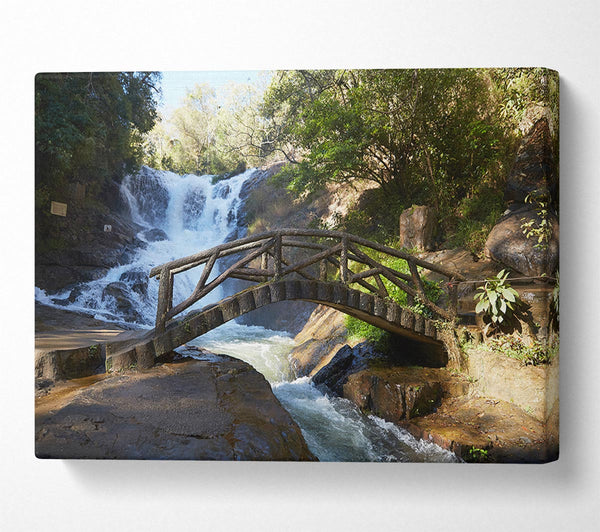  A Canvas Print of Rustic made bridge by a waterfall Canvas Print