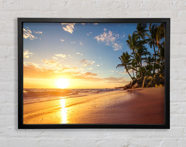 Sunset on the beach sand Framed Print