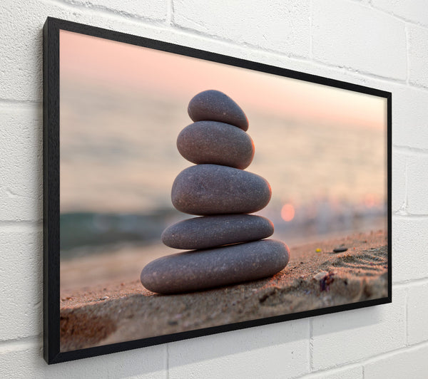 Zen stones stacked up on beach