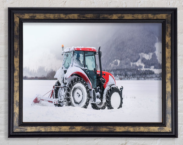 Tractor in the snow Framed Print