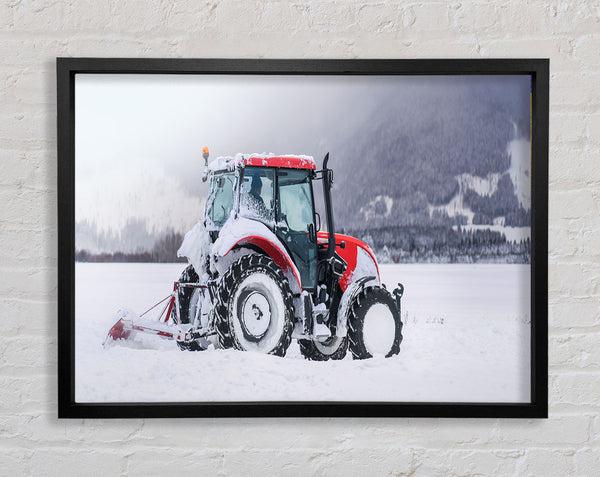 Tractor in the snow Framed Print